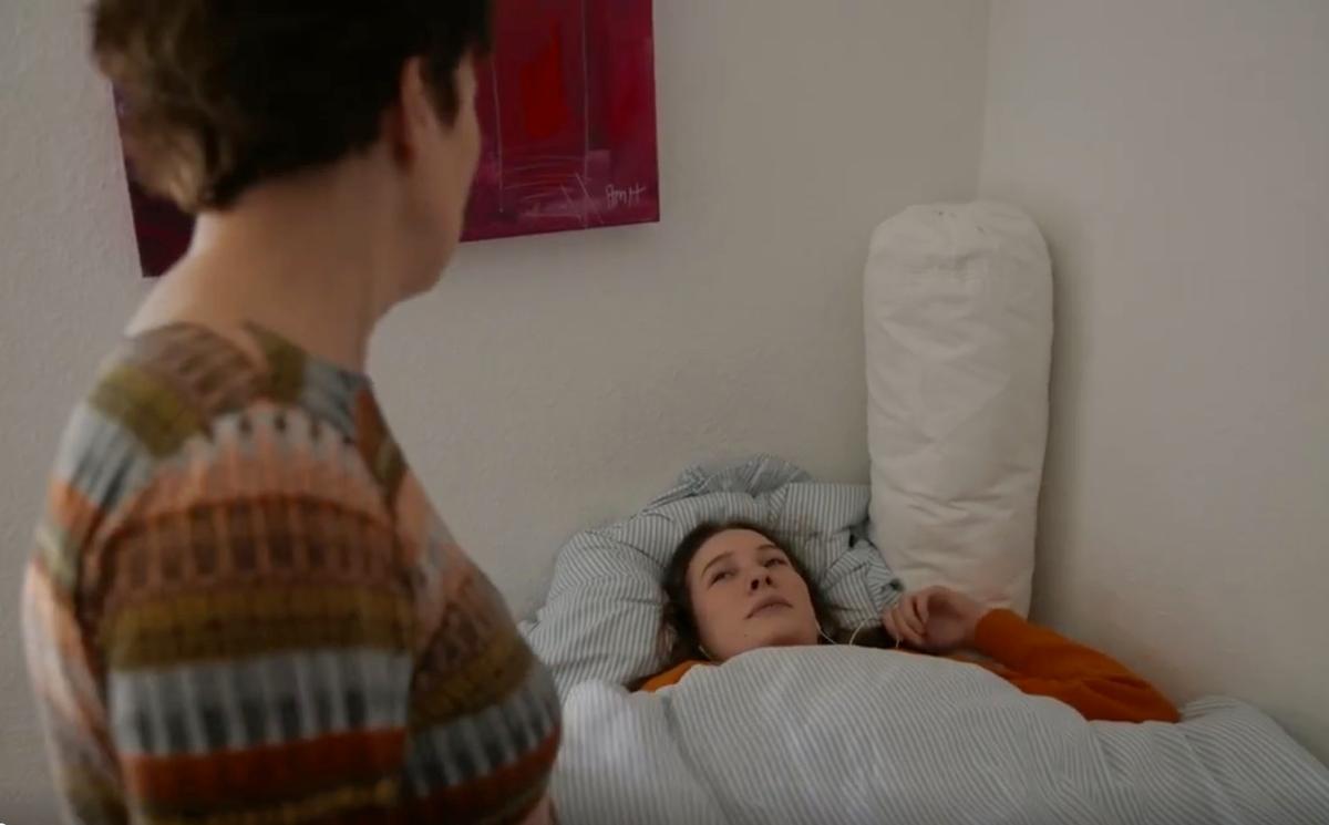 Elizabeth, a 15-year-old girl lying in her bed after experiencing severe fatigue after HPV vaccinations. (Photo from "Under the Skin" documentary.)
