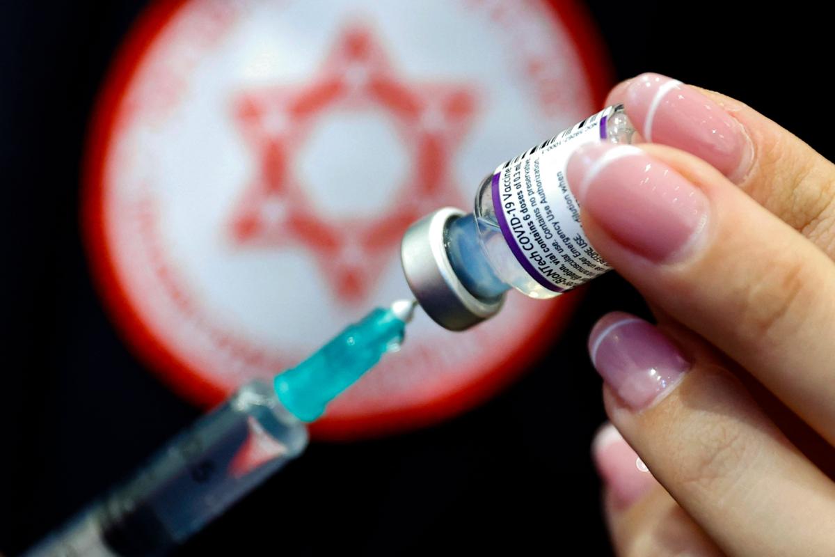 A medic prepares a dose of the Pfizer-BioNTech COVID-19 vaccine at a nursing home in Netanya, Israel, on Jan. 5, 2022. (Jack Guez/AFP via Getty Images)