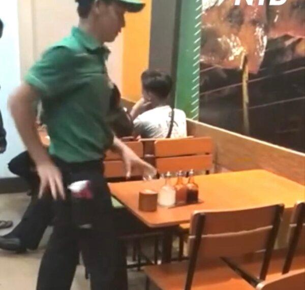 Waiter Cleans and Sets Table With Flair